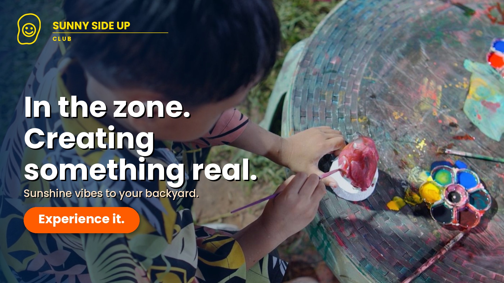 Child creating art outdoors